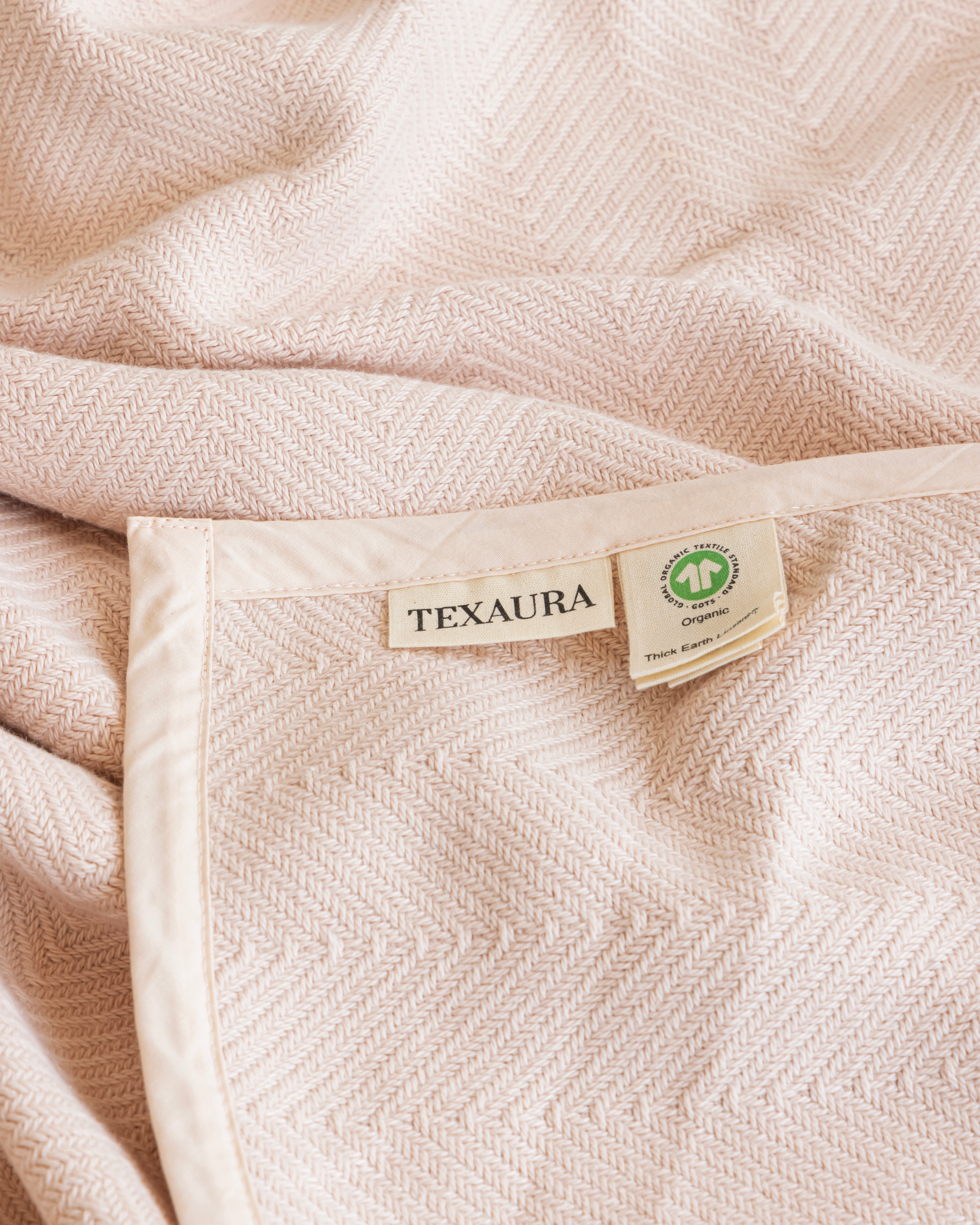Elegant living room with Texaura organic throw draped on a sofa
